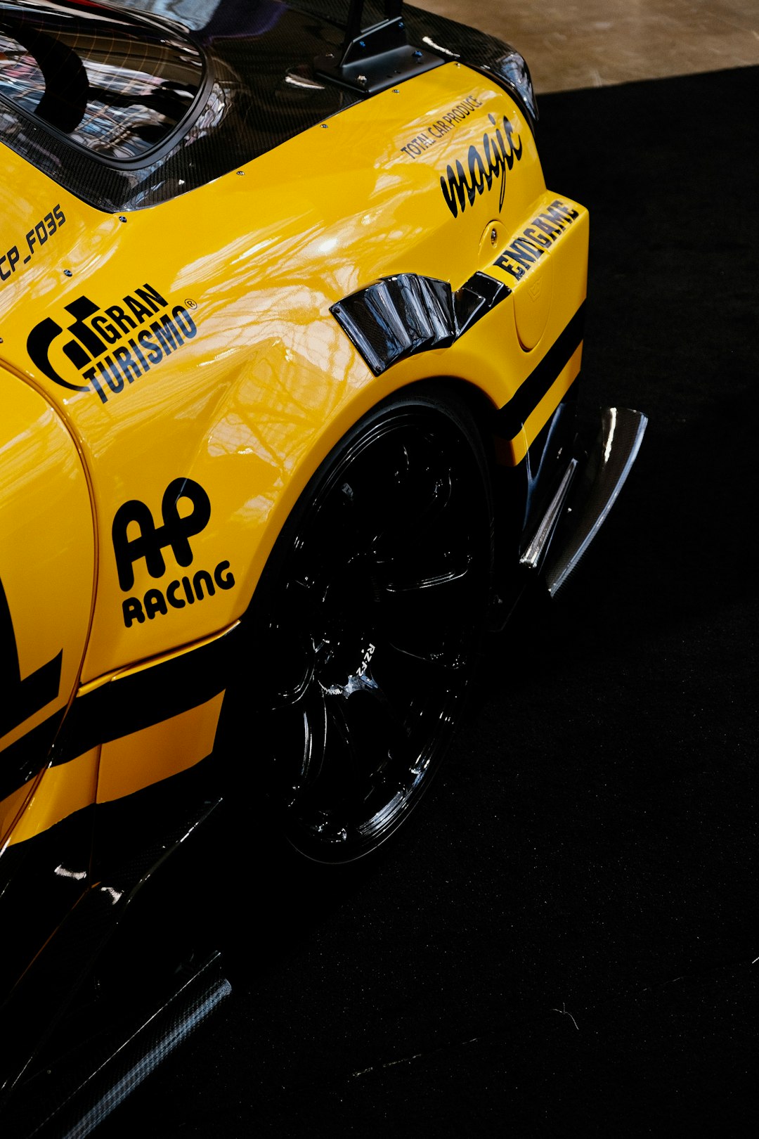 services-02 a-yellow-sports-car-with-a-racing-sticker-on-its-side-vca51flmzha
